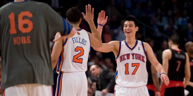Jeremy Lin is greeted by #2 Landry fields during the fourth quarter of a 2012 game.