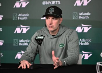Jets general manager Darren Mougey speaking to media at a press conference.