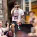 Jose Alvarado celebrating on a parade float during the New York Knicks' 2026 NBA Championship parade.