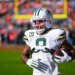 Green Bay Packers running back Josh Jacobs warms up before an NFL football game against the Denver Broncos, Dec. 14, 2025, in Denver.