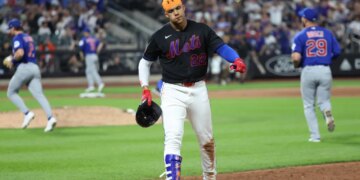 New York Mets left fielder Juan Soto #22 reacts after grounding out with the bases loaded at Citi Field.
