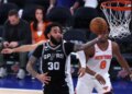 San Antonio Spurs player Julian Champagnie (30) shooting against the New York Knicks in an NBA Finals game.