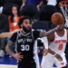 San Antonio Spurs player Julian Champagnie (30) shooting against the New York Knicks in an NBA Finals game.