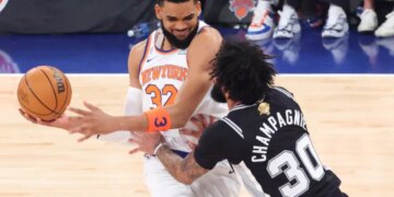 Karl-Anthony Towns struggles to make a move on Julian Champagnie during the Knicks' Game 3 loss to the Spurs at the Garden.