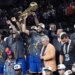 A jubilant Karl-Anthony Towns celebrates with owner James Dolan and his Knicks teammates after their 94-90 Game 5 NBA title-clinching win over the Spurs on June 13, 2026 in San Antonio.