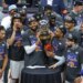 Knicks center Karl-Anthony Towns (32) and the New York Knicks hold up the Eastern Conference Finals trophy at the end the fourth quarter.