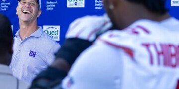John Harbaugh has a laugh as he takes a question from Kayvon Thibodeaux during a press conference with reporters after Giants practice on June 9, 2026.
