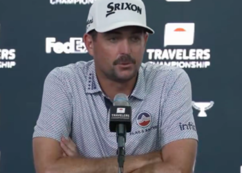 Golfer Max Homa speaking at a press conference.