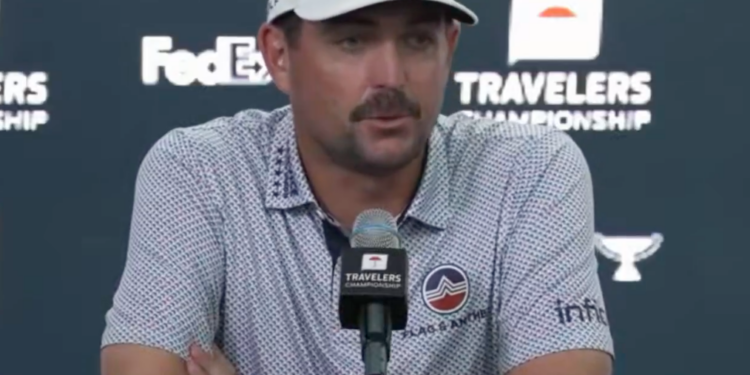 Golfer Max Homa speaking at a press conference.