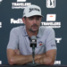 Golfer Max Homa speaking at a press conference.