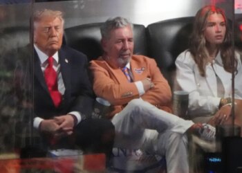 Donald Trump, James Dolan, and Kai Trump watching the NBA Finals.