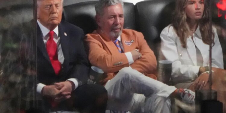 Donald Trump, James Dolan, and Kai Trump watching the NBA Finals.