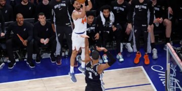 New York Knicks guard Landry Shamet (44) takes a three-point shot over San Antonio Spurs forward Victor Wembanyama (1) during the 2026 NBA Finals.