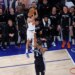 New York Knicks guard Landry Shamet (44) takes a three-point shot over San Antonio Spurs forward Victor Wembanyama (1) during the 2026 NBA Finals.