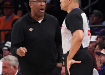 Knicks coach Mike Brown (l.) talks to a referee during the team's Game 3 loss to the Spurs in the NBA Finals on June 8, 2026.