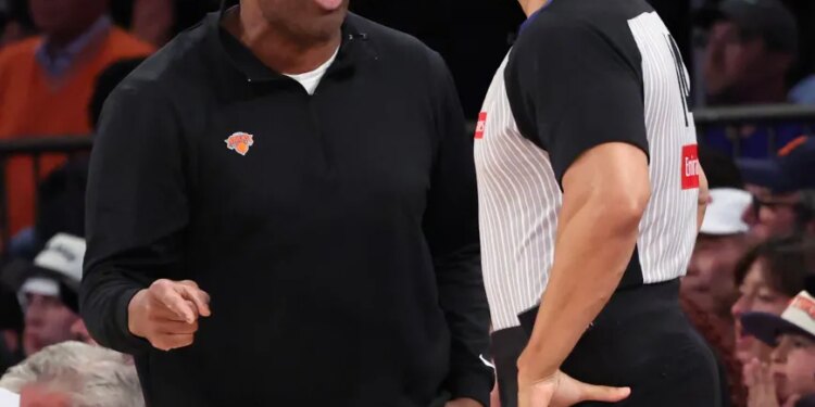 Knicks coach Mike Brown (l.) talks to a referee during the team's Game 3 loss to the Spurs in the NBA Finals on June 8, 2026.