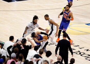 New York Knicks guard Jalen Brunson is fouled by San Antonio Spurs forward Victor Wembanyama late in the final seconds of the fourth quarter.