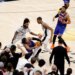 New York Knicks guard Jalen Brunson is fouled by San Antonio Spurs forward Victor Wembanyama late in the final seconds of the fourth quarter.
