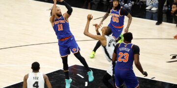 New York Knicks guard Jalen Brunson (11) shoots over San Antonio Spurs forward Victor Wembanyama (1) during Game 5 of the 2026 NBA Finals.