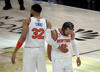 New York Knicks center Karl-Anthony Towns (32) greets New York Knicks guard Jalen Brunson (11) before the start of game 1 of the 2026 NBA Finals.