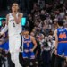 Victor Wembanyama of the San Antonio Spurs walks off the court while New York Knicks players Landry Shamet, Josh Hart, and Mitchell Robinson celebrate during Game 2 of the NBA Finals.