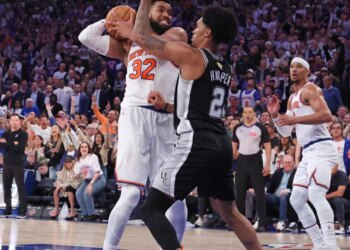 New York Knicks vs. San Antonio Spurs at Madison Square Garden - New York Knicks center Karl-Anthony Towns #32 rebounds the ball away from San Antonio Spurs guard Dylan Harper #2 in the 2nd quarter.
