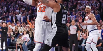 New York Knicks vs. San Antonio Spurs at Madison Square Garden - New York Knicks center Karl-Anthony Towns #32 rebounds the ball away from San Antonio Spurs guard Dylan Harper #2 in the 2nd quarter.