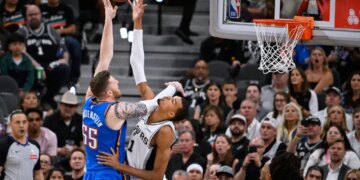 San Antonio Spurs forward Victor Wembanyama, right, blocks a shot by Oklahoma City Thunder center Isaiah Hartenstein during the second half of Game 4 in the Western Conference finals NBA basketball playoffs series in San Antonio, Sunday, May 24, 2026.