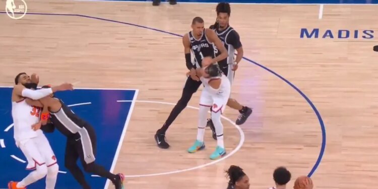 The Spurs' Victor Wembanyama (1) shoves Knicks guard Jalen Brunson (11) in the back of the head during Game 3 of the NBA Finals at MSG on June 8, 2026.