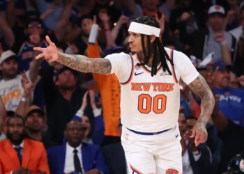 New York Knicks guard Jordan Clarkson #00 reacts after hitting a three-point shot.