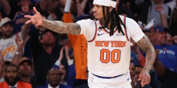 New York Knicks guard Jordan Clarkson #00 reacts after hitting a three-point shot.