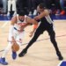 New York Knicks vs. San Antonio Spurs at Madison Square Garden - New York Knicks center Karl-Anthony Towns #32 drives down court as San Antonio Spurs forward Victor Wembanyama #1 defends during the first quarter.