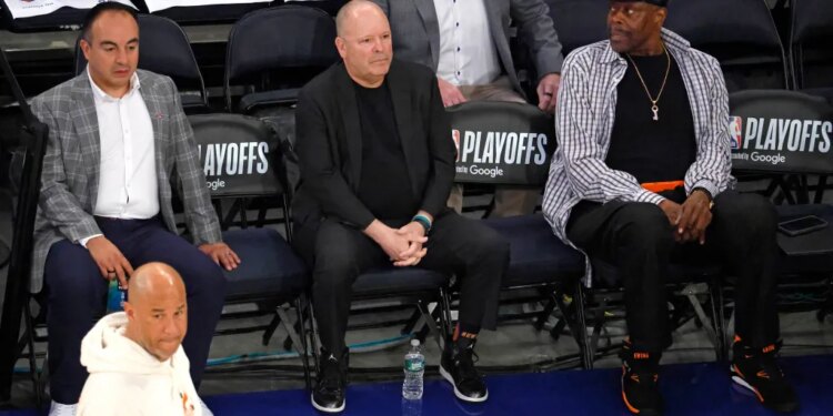 Gersson Rosas, Leon Rose, and Patrick Ewing watch warm-ups before Game 1 of the Eastern Conference Finals.