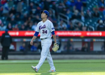 New York Mets pitcher Kodai Senga (34) walks off the field.