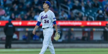 New York Mets pitcher Kodai Senga (34) walks off the field.