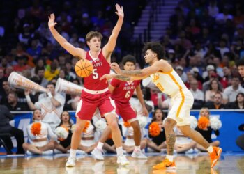 Tennessee Volunteers guard Ja'kobi Gillespie (0) passes the ball as Miami (OH) RedHawks guard Peter Suder (5) defends during an NCAA Tournament game.
