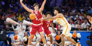 Tennessee Volunteers guard Ja'kobi Gillespie (0) passes the ball as Miami (OH) RedHawks guard Peter Suder (5) defends during an NCAA Tournament game.