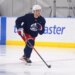 New York Rangers player Liam Greentree (85) skating on ice with a hockey stick during development camp.