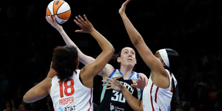 New York Liberty forward Breanna Stewart looks to put up a shot past a defending Washington Mystics defense in the first half at the Barclays Center in Brooklyn, New York, USA, Friday, June 19, 2026.