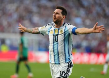 Lionel Messi celebrating a goal during a World Cup match.