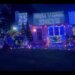 A Long Island house decorated with blue and orange lights and signs for the NBA finals.