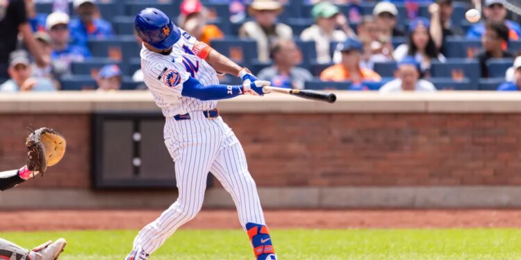 New York Mets second baseman Marcus Semien (10) hitting a two-run home run.