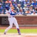 New York Mets second baseman Marcus Semien (10) hitting a two-run home run.