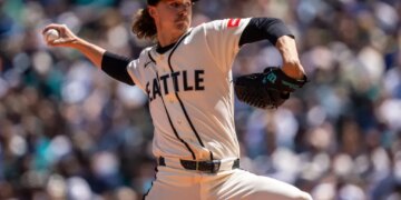 Seattle Mariners pitcher Bryce Miller in mid-delivery during a game.