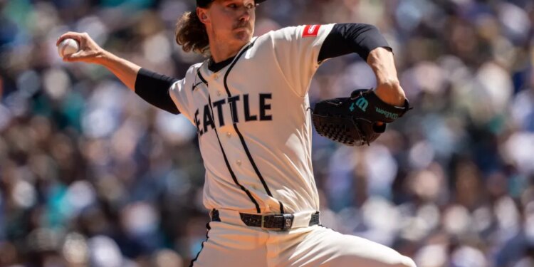 Seattle Mariners pitcher Bryce Miller in mid-delivery during a game.