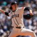 Seattle Mariners pitcher Bryce Miller in mid-delivery during a game.