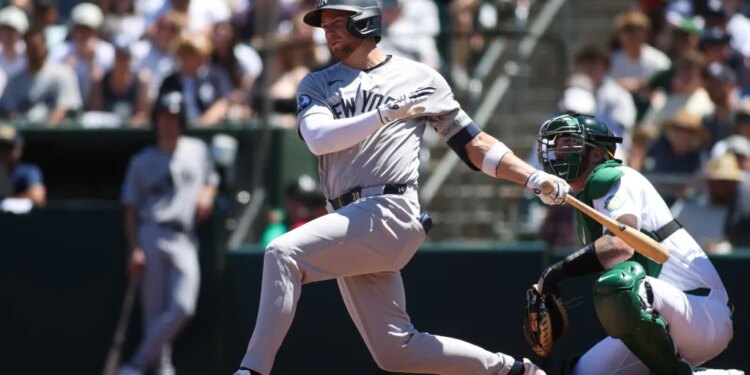 Max Schuemann swinging a baseball bat during a game.