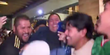 Fox Sports Mexico reporter Carlos Rodrigo Hernandez is lifted in the air by fans