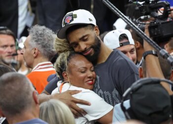Mikal Bridges #25, getting a hug after the Knicks defeated the Spurs to win the NBA Championship.
