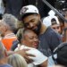 Mikal Bridges #25, getting a hug after the Knicks defeated the Spurs to win the NBA Championship.